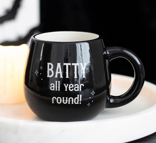 Batty All Year Round Mug, black ceramic with white Batty all year round lettering, close-up