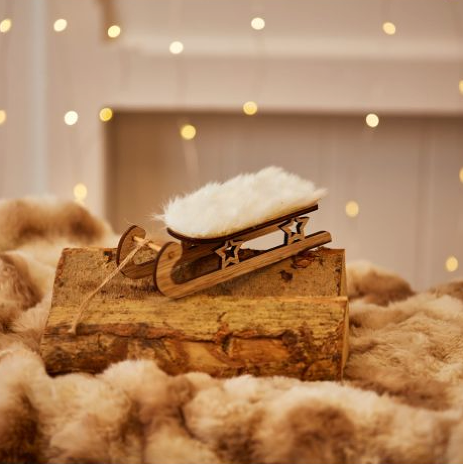 Fluffy Sleigh Hanging Decoration, wooden sleigh with a fluffy white seat on faux fur