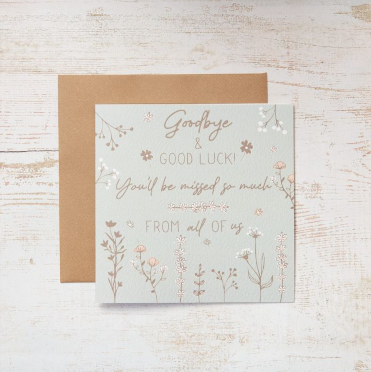 Goodbye & Good Luck Meadow Flowers Card, a white card with script wording and wildflowers, with kraft envelope