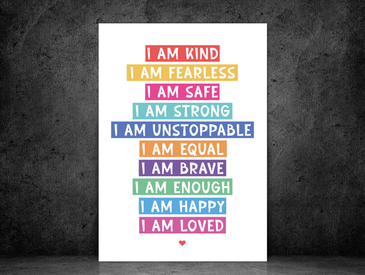 I Am Affirmation Colour print with colourful affirmation lines, shown against a dark concrete wall