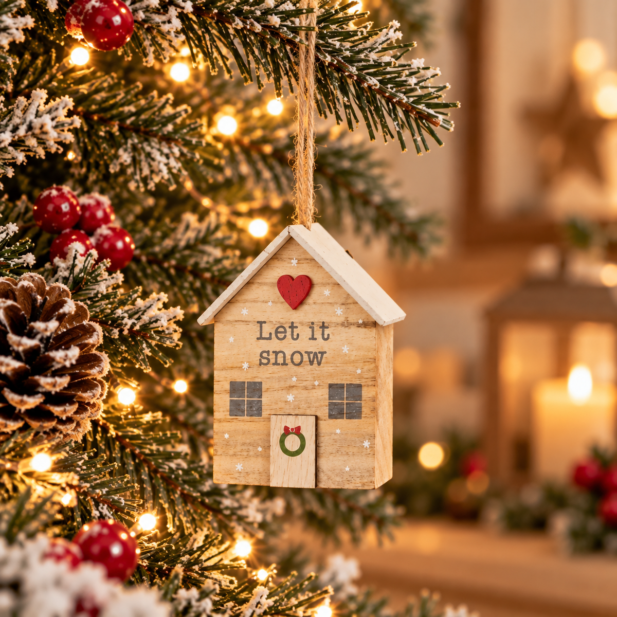 Let It Snow wooden house hanging decoration with a white roof, red heart and miniature wreath