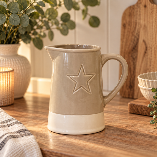 Grey Embossed Star Jug, a ceramic jug in soft taupe glaze with a cream base and embossed star