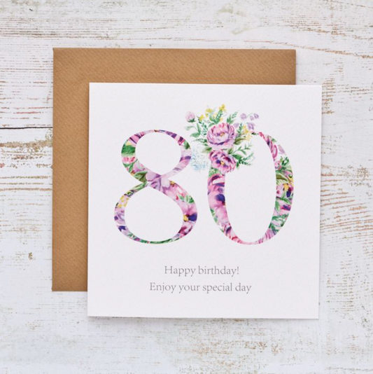 80 Floral Birthday Card with a large 80 filled with purple and pink flowers, with a kraft envelope