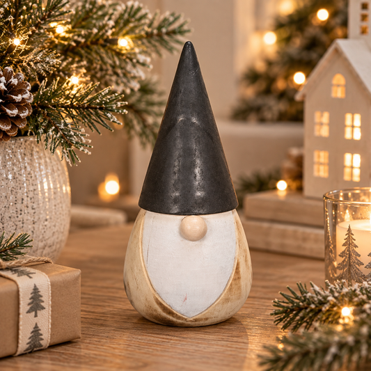 Wooden Santa Gonk With Black Hat, a pale wooden gonk with a white beard and tall black hat, beside ceramic houses