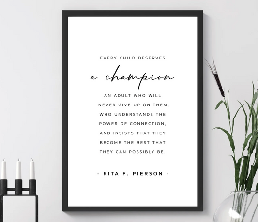 A Champion - Teacher print with Every child deserves a champion quote in black text, framed on a sideboard