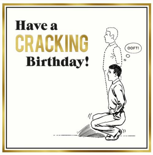 A Cracking Birthday! greetings card with a line drawing of a man kneeling and black and gold lettering