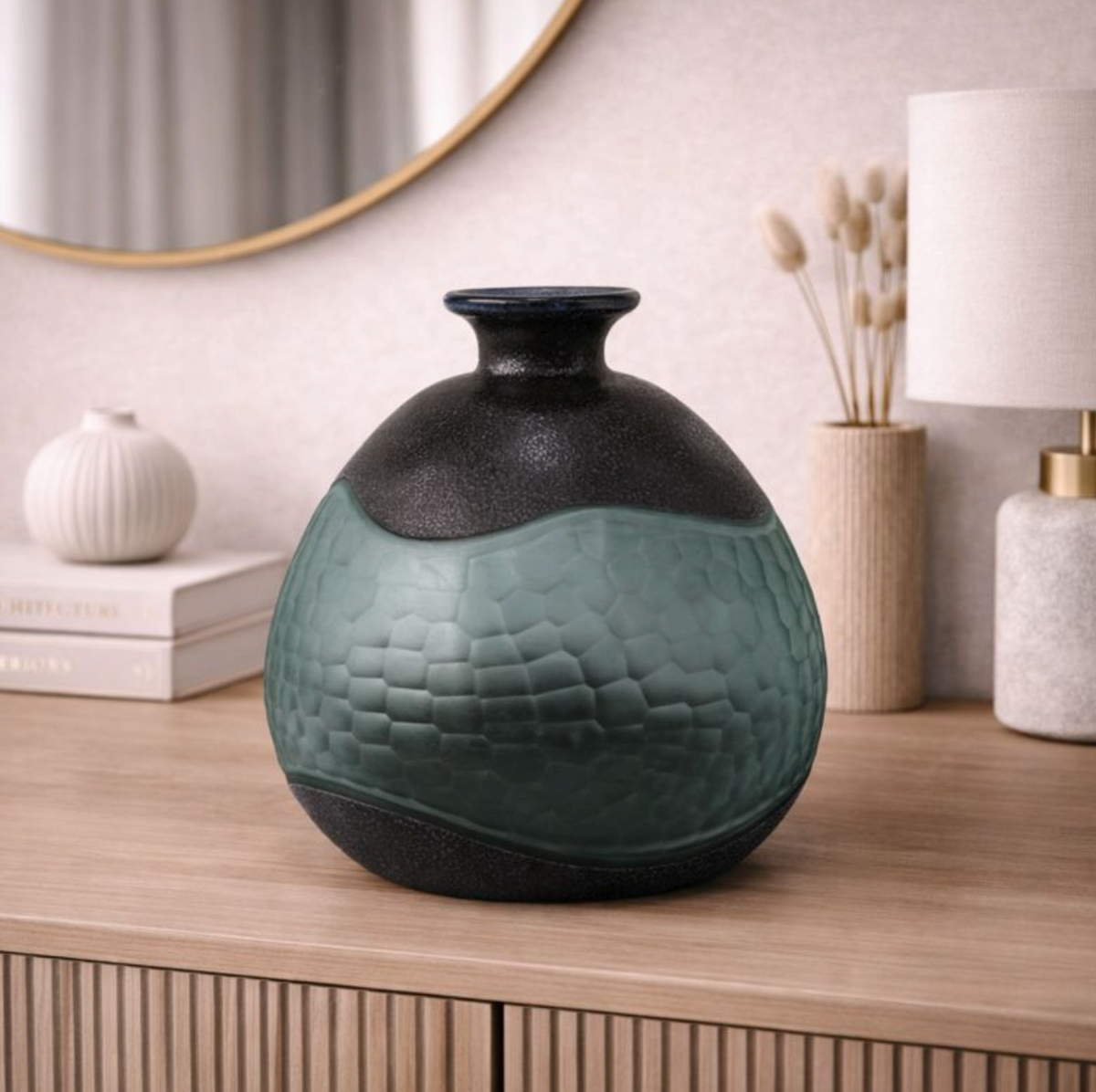 Black & Green Handmade Glass Design Vase, squat hammered vase on a sideboard with ceramics