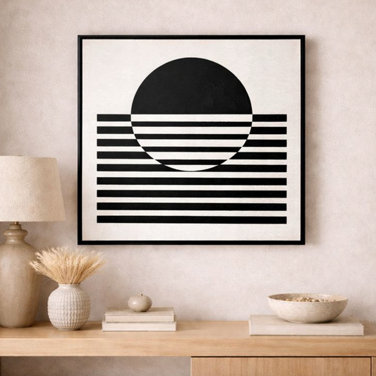 Black & White Lines Abstract Framed Canvas, a striped half-circle design, hung above a rattan sideboard