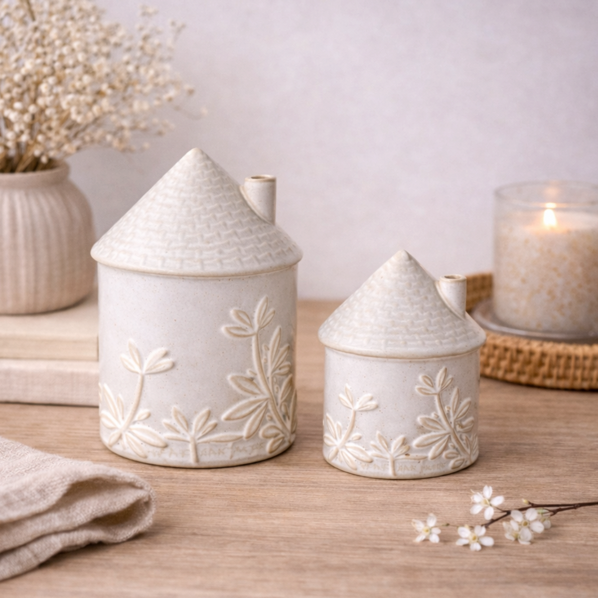 Ceramic House Ornament with Floral Detail, large white house beside a smaller one and candle