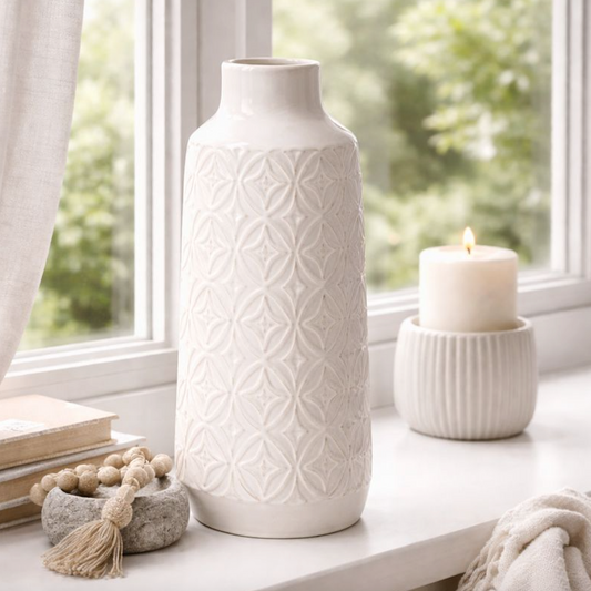 Embossed Ceramic Vase with Geometric Pattern, Large, cream vase on a windowsill beside a ribbed candle