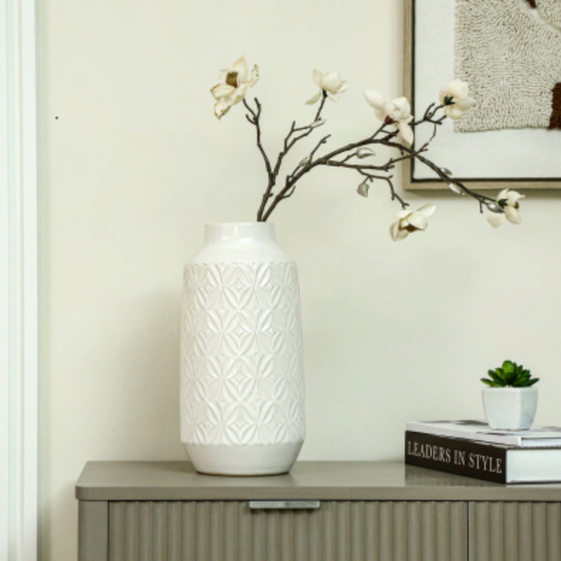 Embossed Ceramic Vase with Geometric Pattern, Medium, with white blossom on a grey sideboard by books