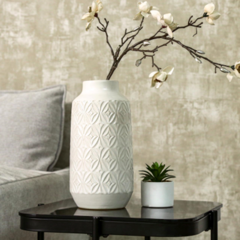 Embossed Ceramic Vase with Geometric Pattern, Medium, cream vase with blossom stems on a black side table
