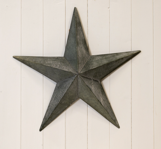 Grey Metal Barn Star, Large, alternative view of the distressed dark metal star as a wall feature