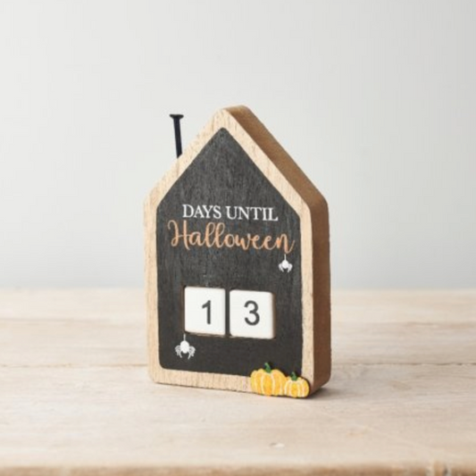 House Days Until Halloween countdown block with a chalkboard front and 13 on its number cubes, plain background