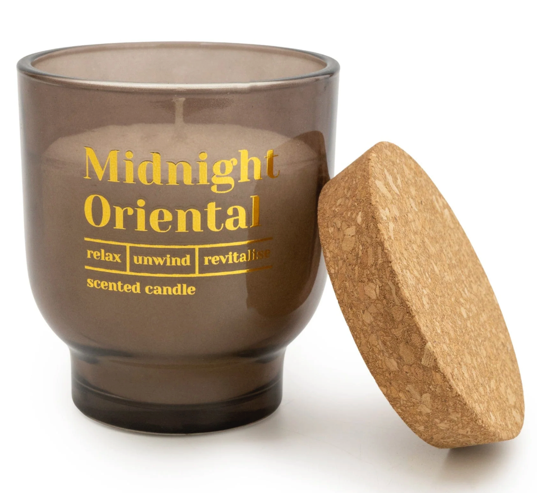 Midnight Oriental Scented Candle, smoky brown glass jar with gold text shown with its cork lid off