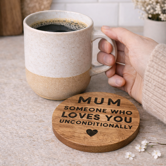 Mum Round Wooden Coaster with a stoneware mug of coffee held in a hand