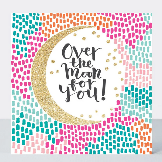 Over The Moon For You Card with a gold glitter crescent moon and script text on a colourful dotted background