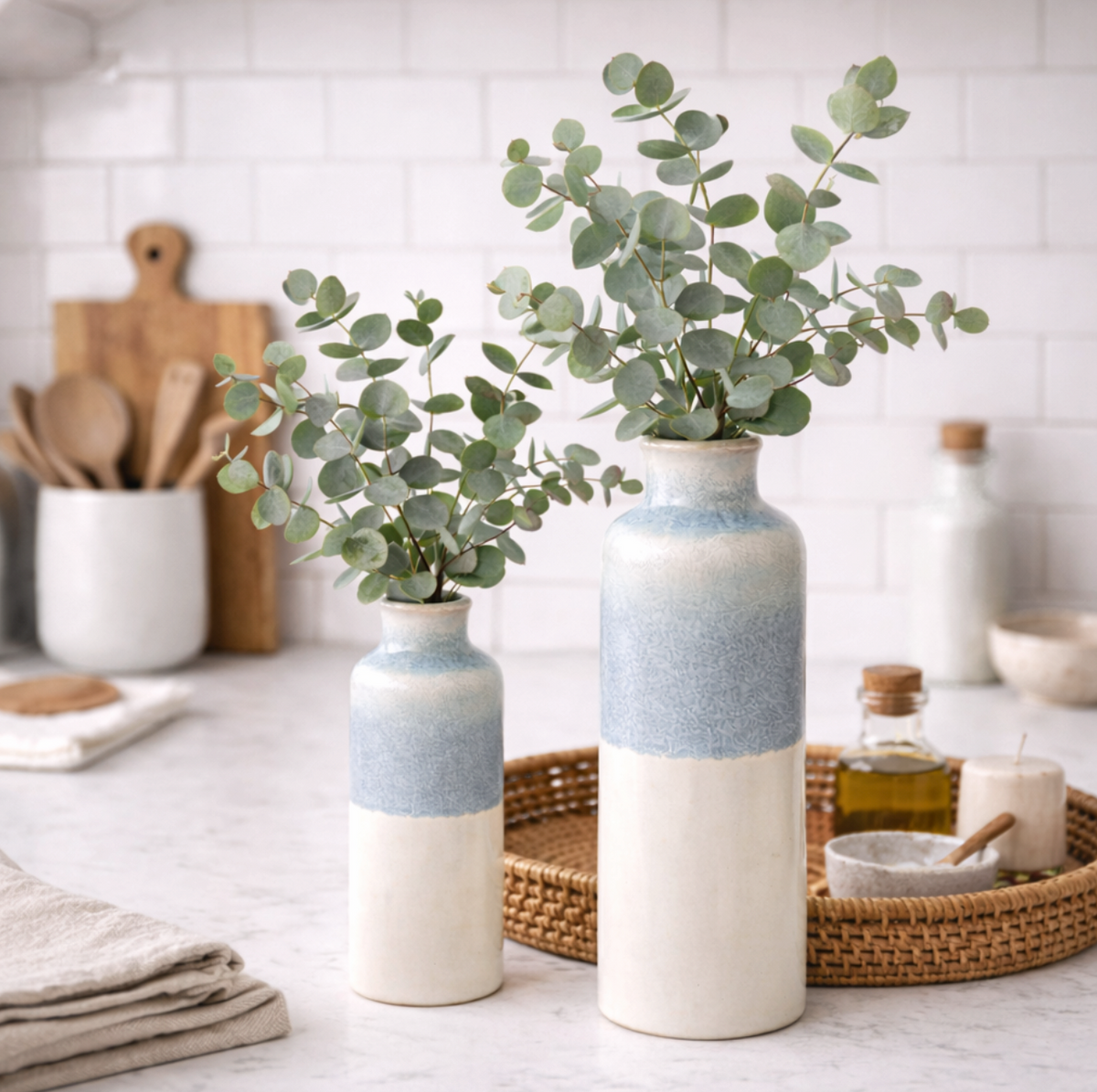 Serene Blue Reactive Glaze Vase, Large with eucalyptus on a kitchen worktop