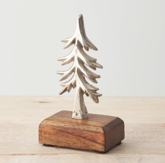 Silver Metal Christmas Tree on Wooden Base, textured silver tree on a dark wood block, on white
