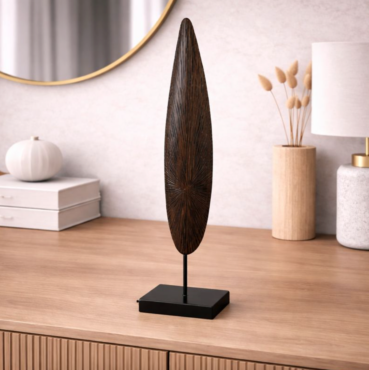 Solara Spire Sculpture in dark wood on a slim black base, styled on a light oak console beside white decor