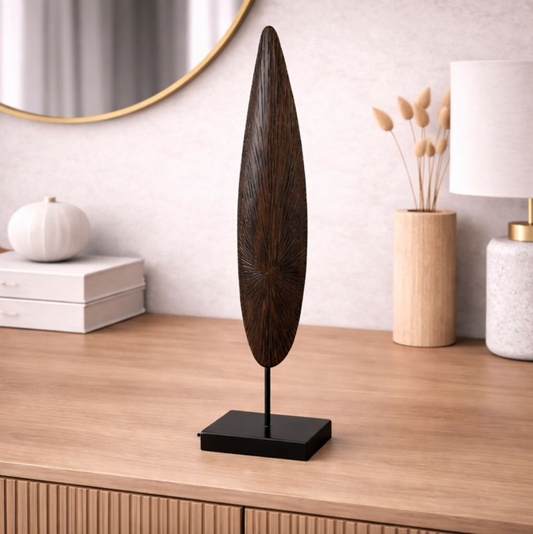 Solara Spire Sculpture in dark wood on a slim black base, styled on a light oak console beside white decor