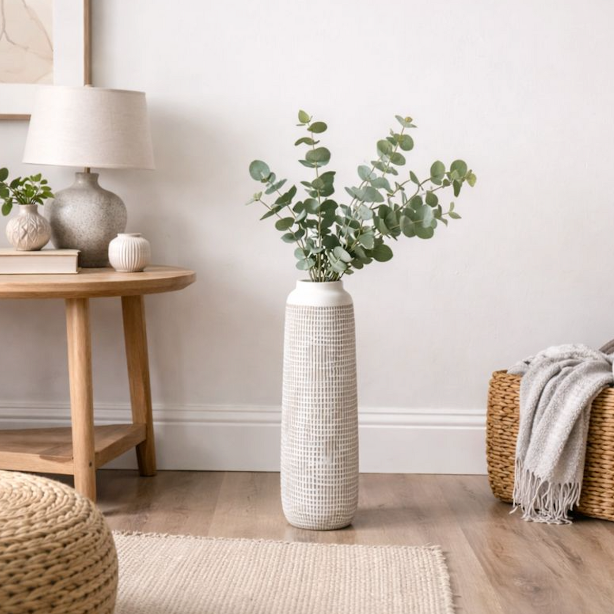 Textured Tall Polyresin Floor Vase, Large, cream textured vase with eucalyptus on the floor by a side table
