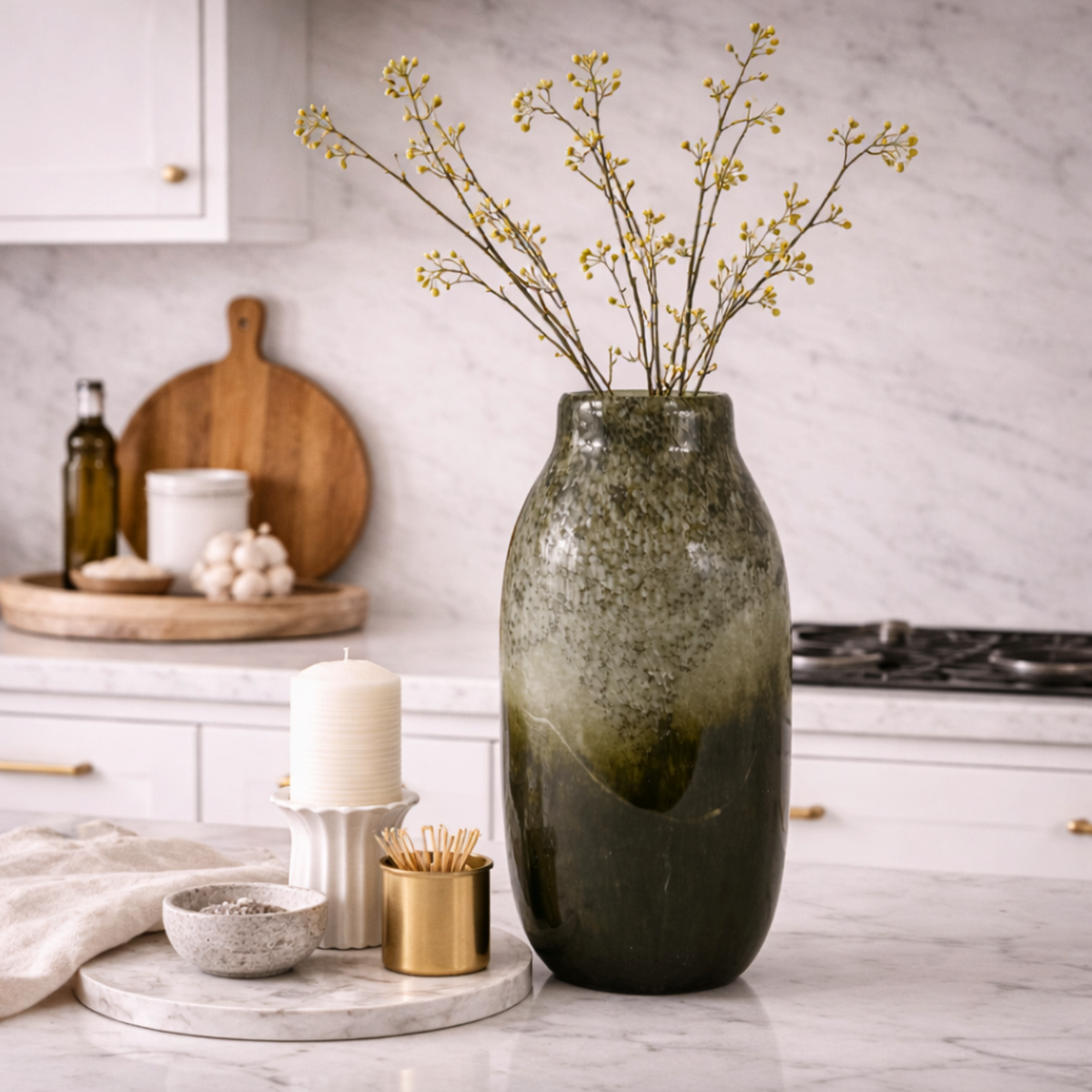 Verde Echo Handmade Glass Vase, Large, in deep green ombre glass holding dried gypsophila on a kitchen worktop