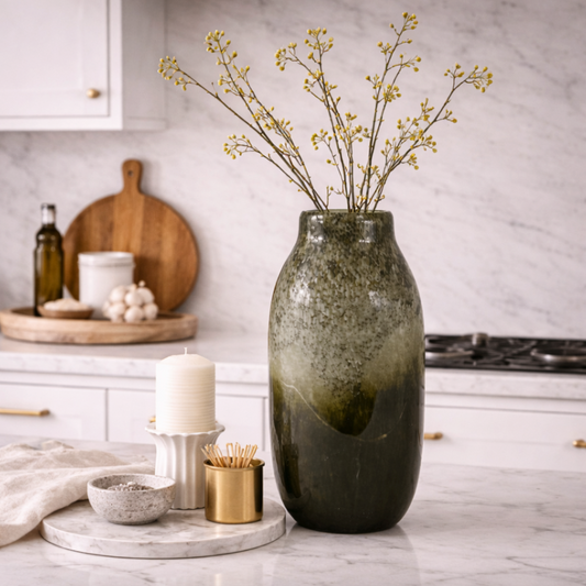 Verde Echo Handmade Glass Vase, Large, in deep green ombre glass holding dried gypsophila on a kitchen worktop